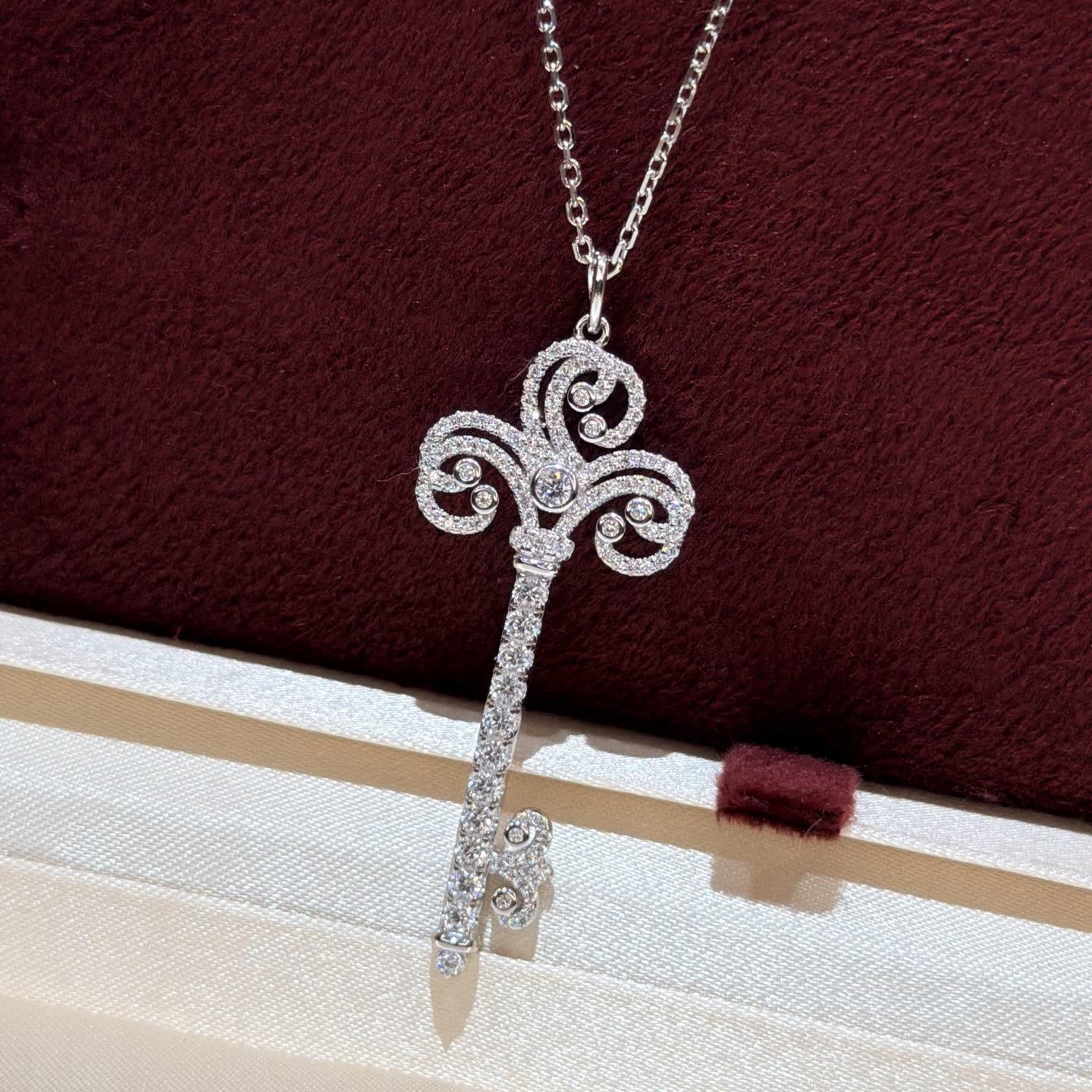 Tiffany & Co Elegant Silver Key Pendant with Diamonds Tiffany & Co Elegant Silver Key Pendant with Diamonds